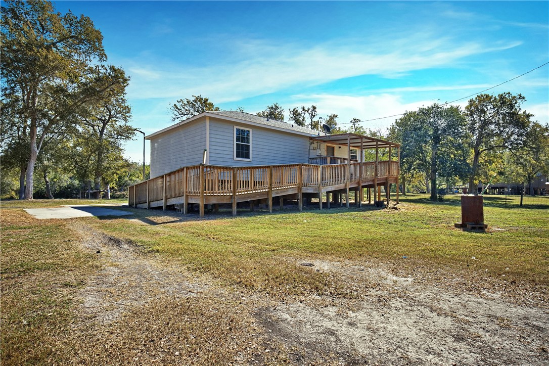 333 Mission River Oaks Road Woodsboro, TX 78393 - Photo 10 of 26 a view of a house with a yard