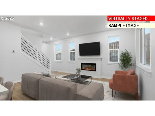 a dining room with furniture a window and a potted plant