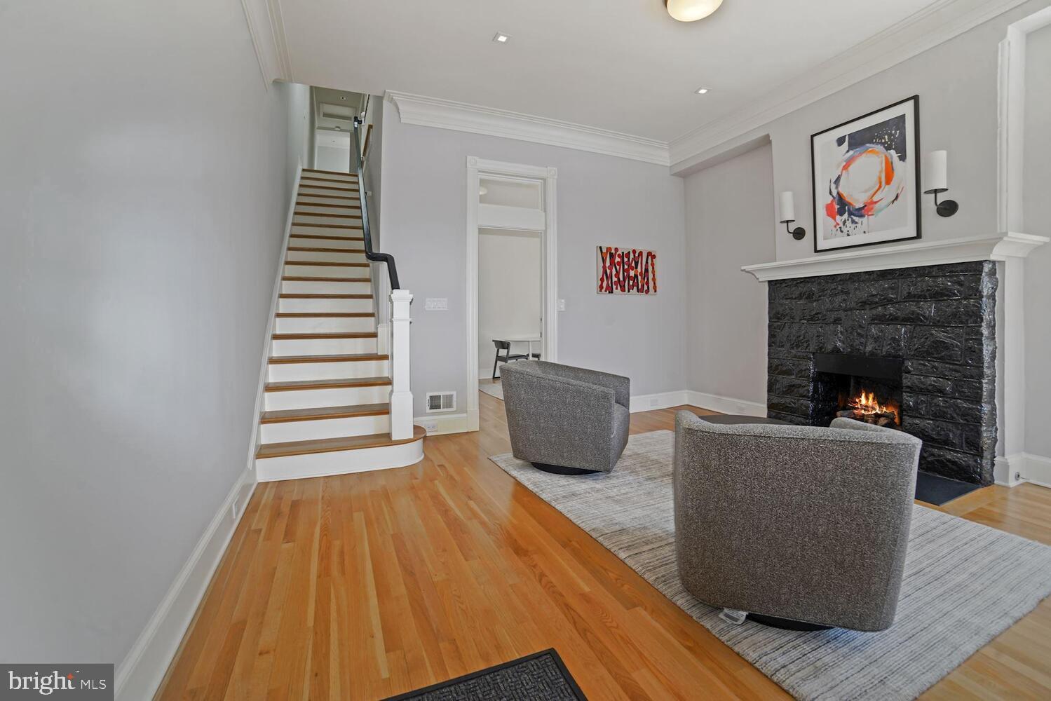 3348 Prospect Street Northwest, Unit 2 Washington, DC 20007 - Photo 8 of 11 a living room with furniture and a fireplace