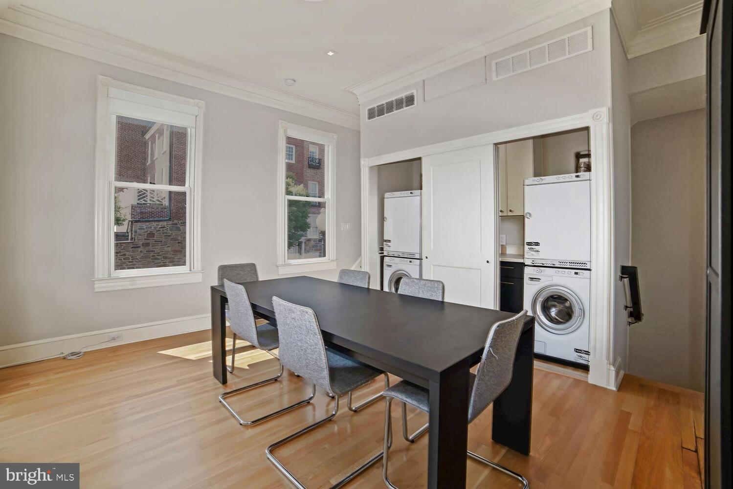 3348 Prospect Street Northwest, Unit 2 Washington, DC 20007 - Photo 9 of 11 a view of a dining room with furniture and wooden floor