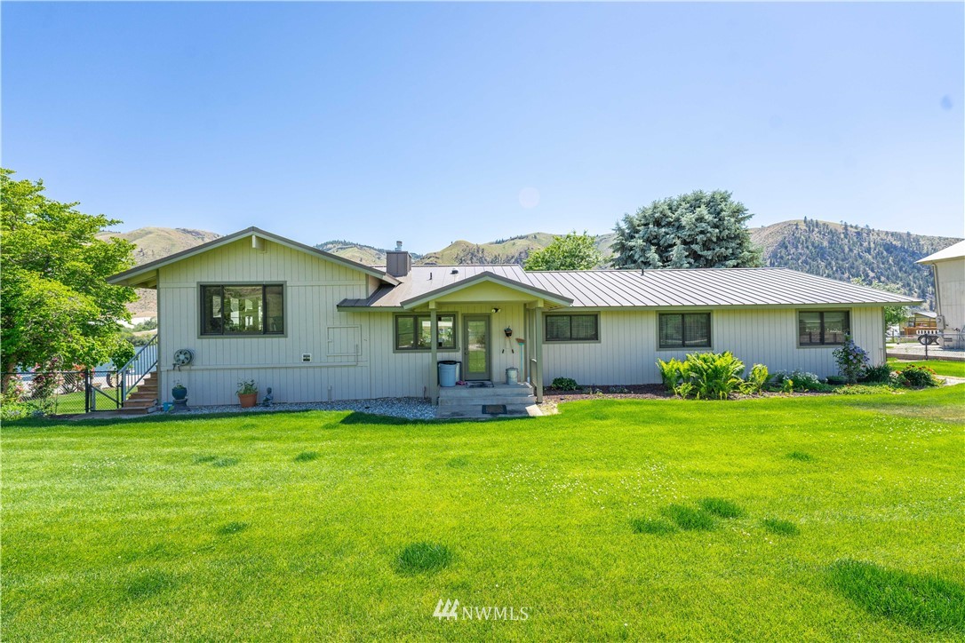 485 Stayman Flats Road Chelan, WA 98816 - Photo 13 of 32 a view of a house with a yard
