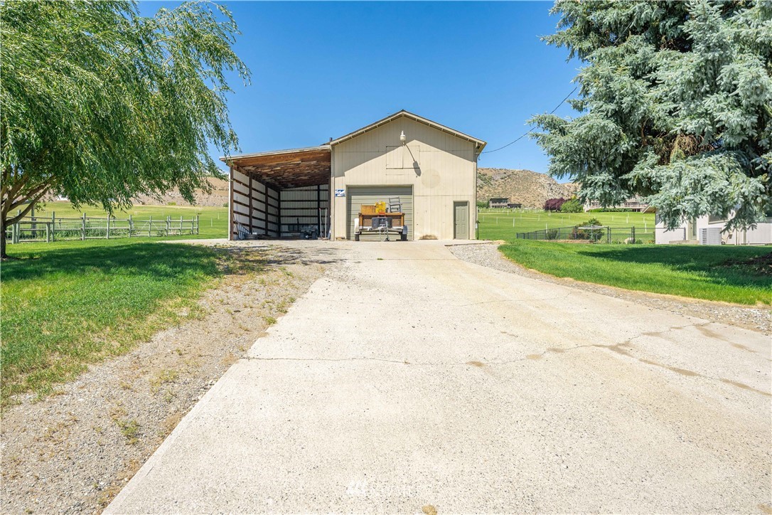 485 Stayman Flats Road Chelan, WA 98816 - Photo 19 of 32 front view of a house with a yard