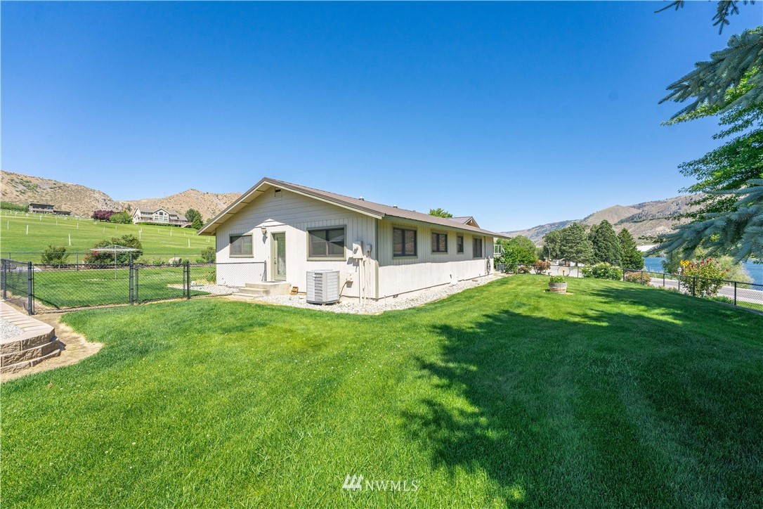 485 Stayman Flats Road Chelan, WA 98816 - Photo 20 of 32 a view of a house with backyard and garden