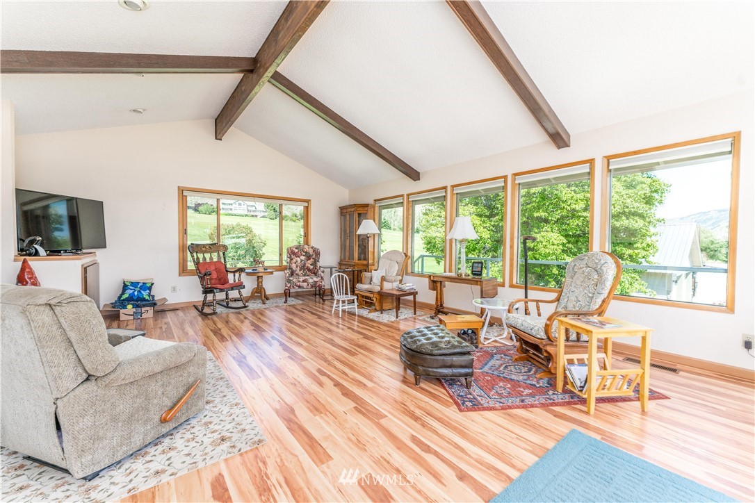 485 Stayman Flats Road Chelan, WA 98816 - Photo 3 of 32 a living room with furniture and a large window