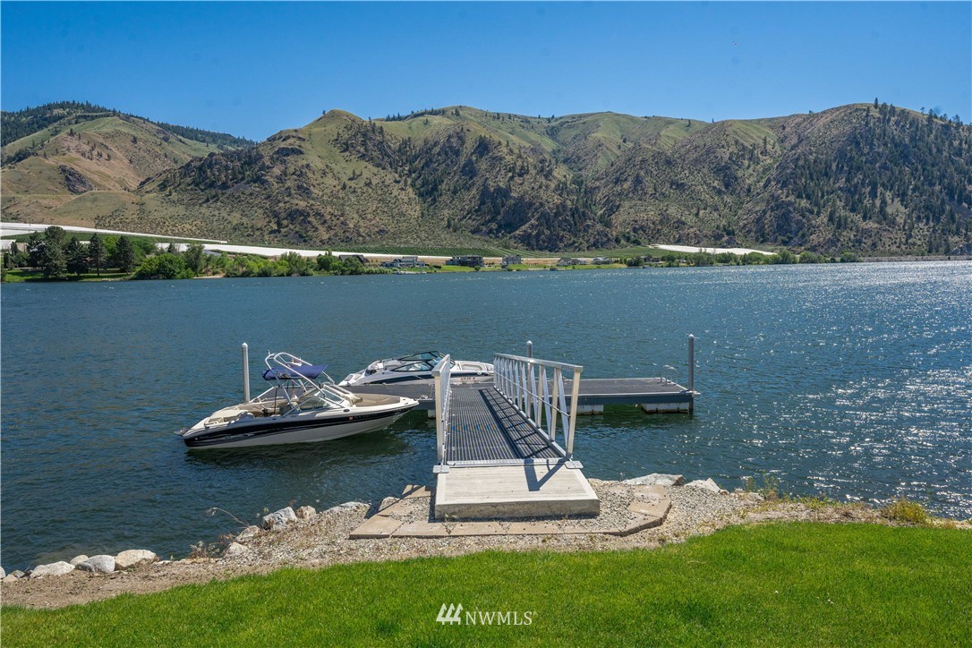 485 Stayman Flats Road Chelan, WA 98816 - Photo 25 of 32 a view of a lake with a mountain in the background