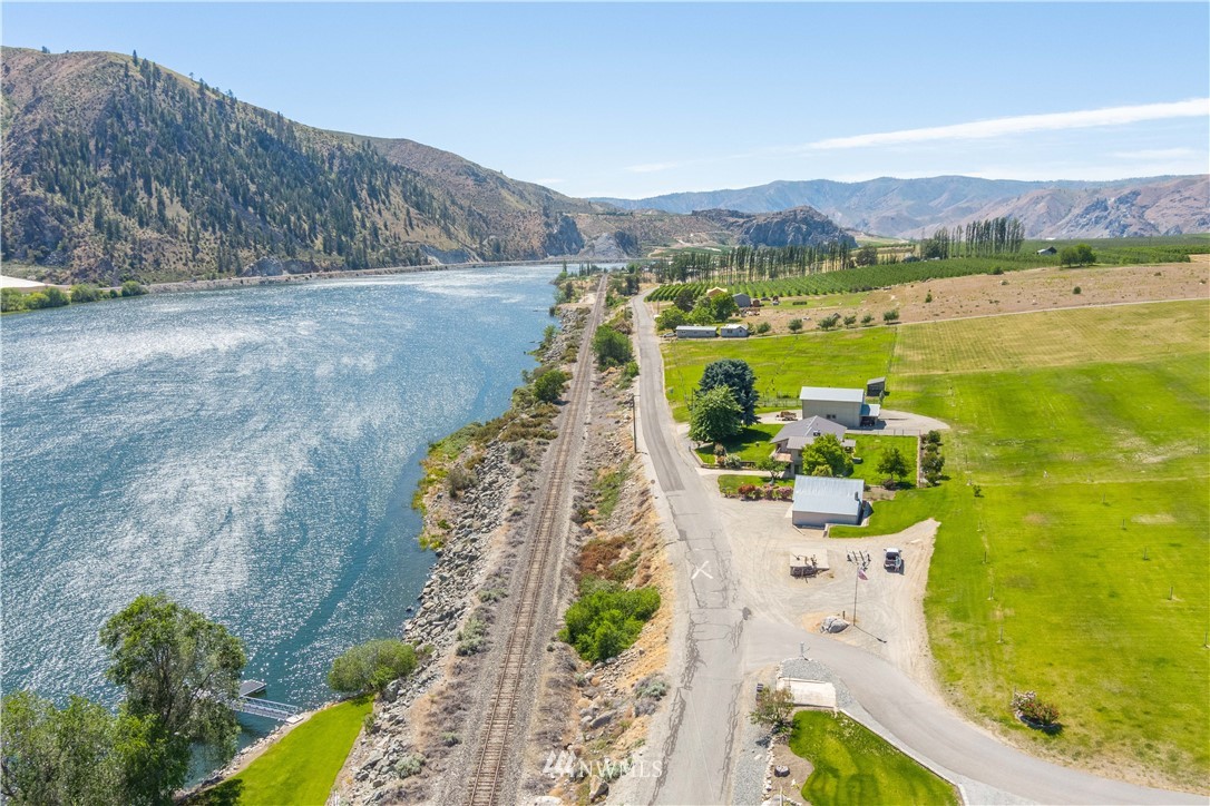 485 Stayman Flats Road Chelan, WA 98816 - Photo 26 of 32 a view of a swimming pool with a yard