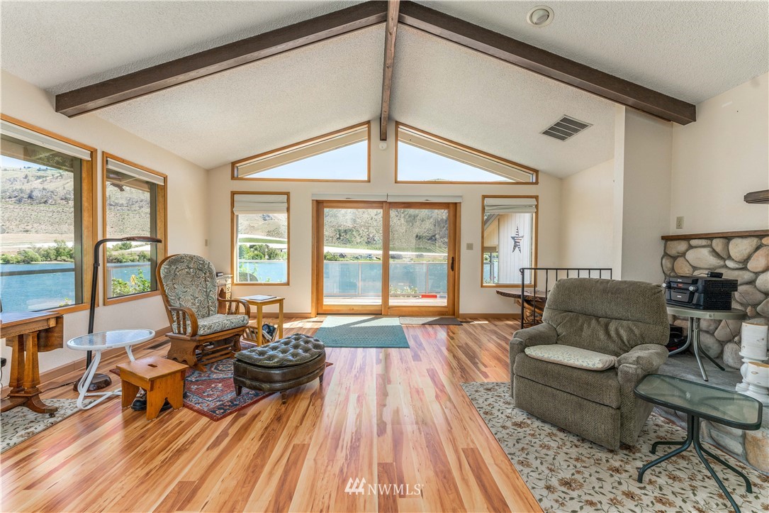 485 Stayman Flats Road Chelan, WA 98816 - Photo 4 of 32 a living room with furniture and a large window