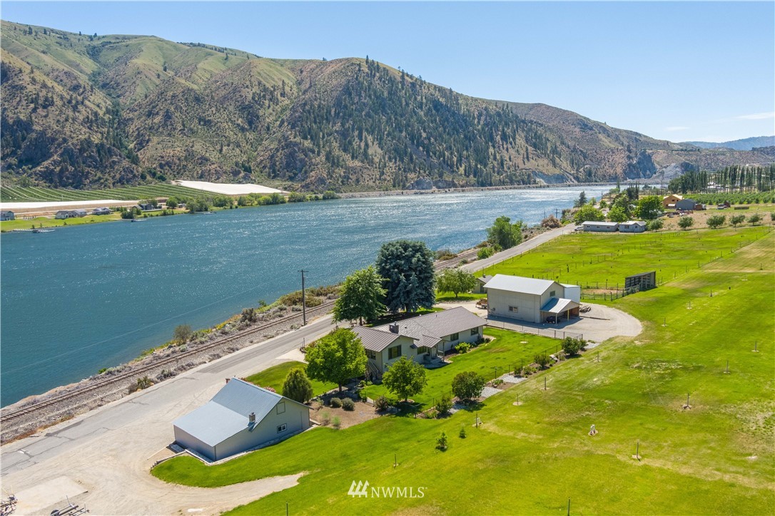 485 Stayman Flats Road Chelan, WA 98816 - Photo 31 of 32 a view of a lake with a mountain in the back
