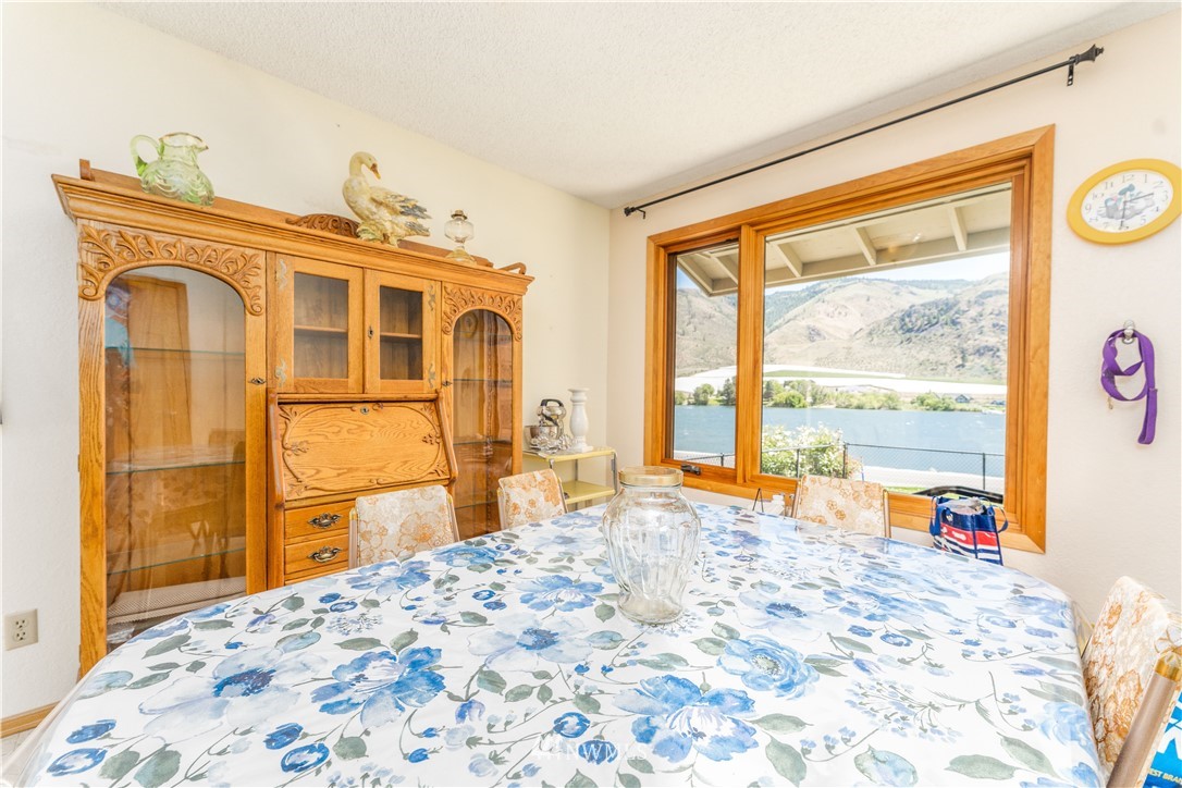485 Stayman Flats Road Chelan, WA 98816 - Photo 8 of 32 a bedroom with a bed and wooden floor