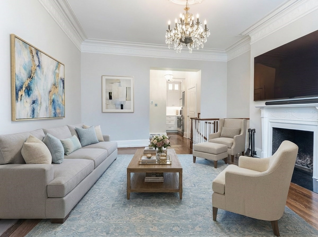 461 Beacon Street, Unit 1 Boston, MA 02115 - Photo 2 of 8 a living room with furniture fireplace and flat screen tv