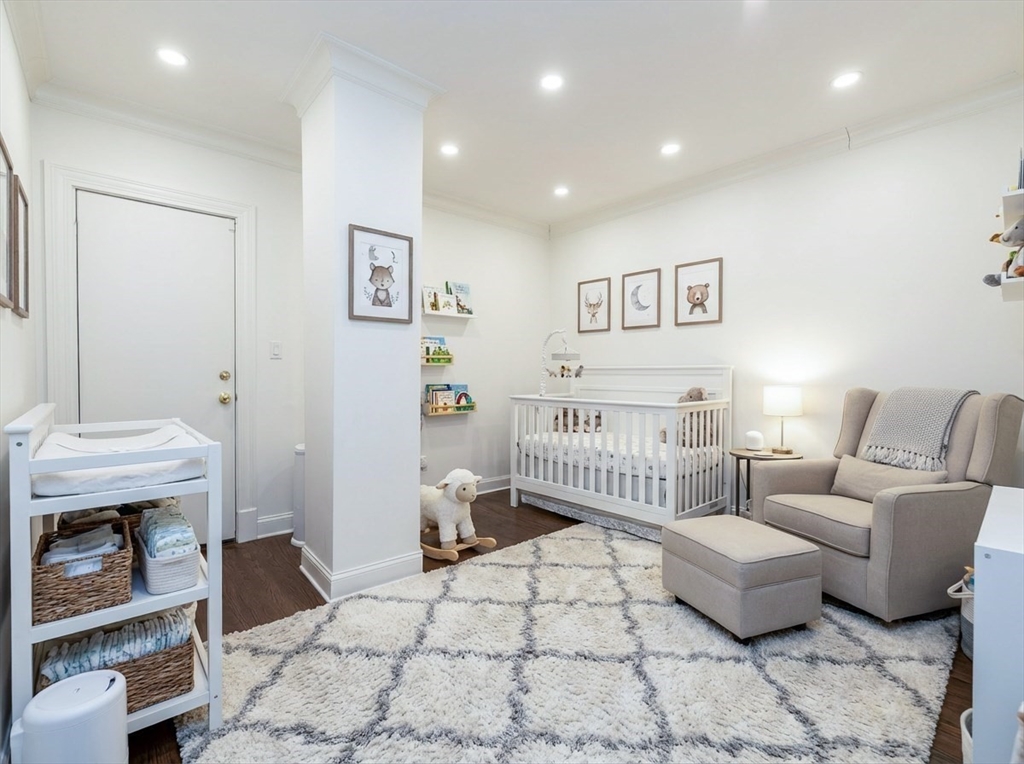 461 Beacon Street, Unit 1 Boston, MA 02115 - Photo 5 of 8 a bedroom with furniture and a couch