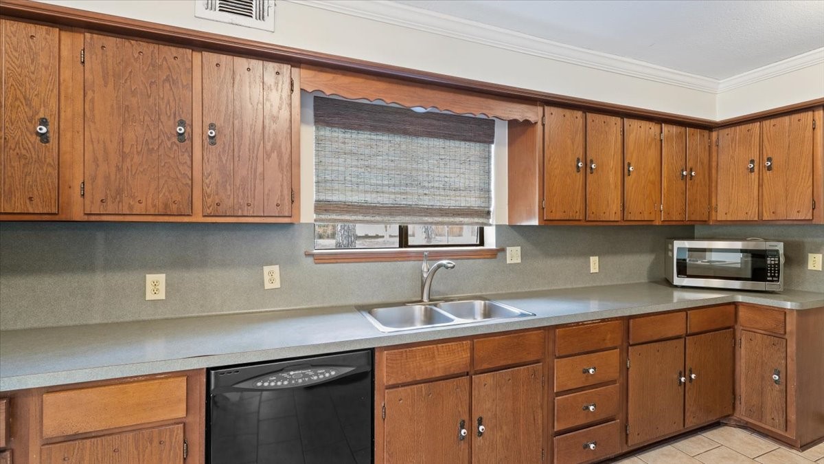 6502 Moccasin Bend Drive Spring, TX 77379 - Photo 18 of 38 a kitchen with stainless steel appliances granite countertop white cabinets a sink and dishwasher