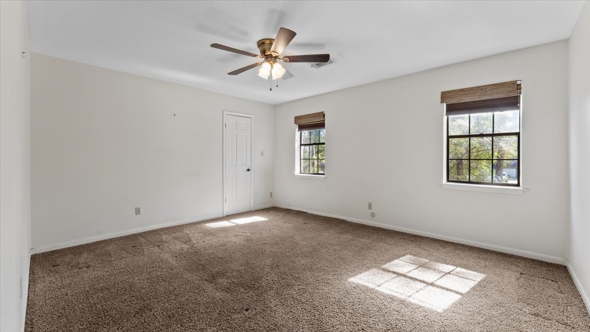 6502 Moccasin Bend Drive Spring, TX 77379 - Photo 23 of 38 an empty room with windows and fan