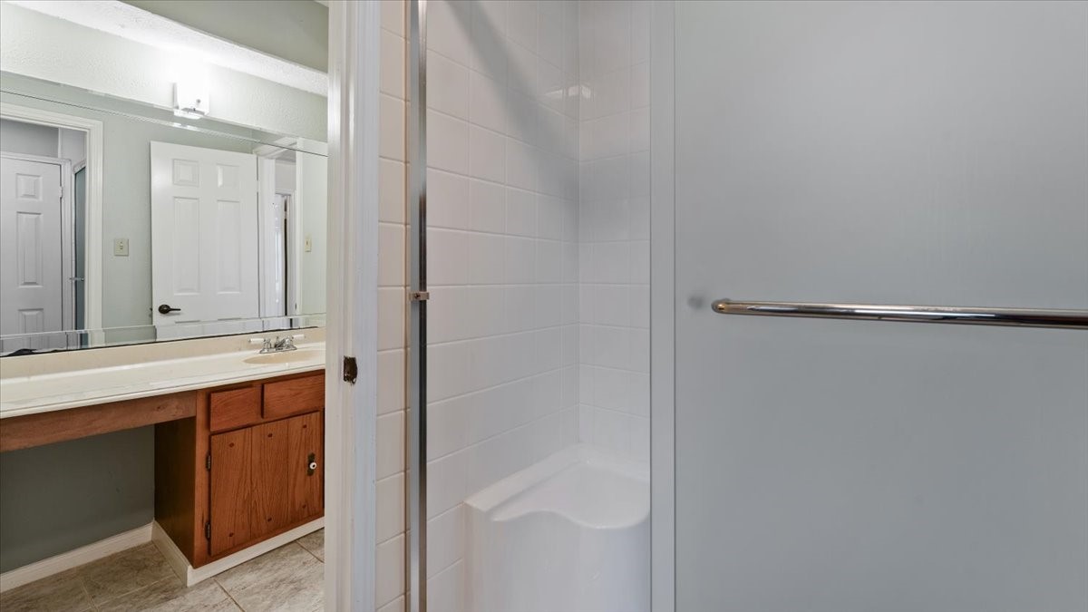 6502 Moccasin Bend Drive Spring, TX 77379 - Photo 25 of 38 a bathroom with a sink and mirror