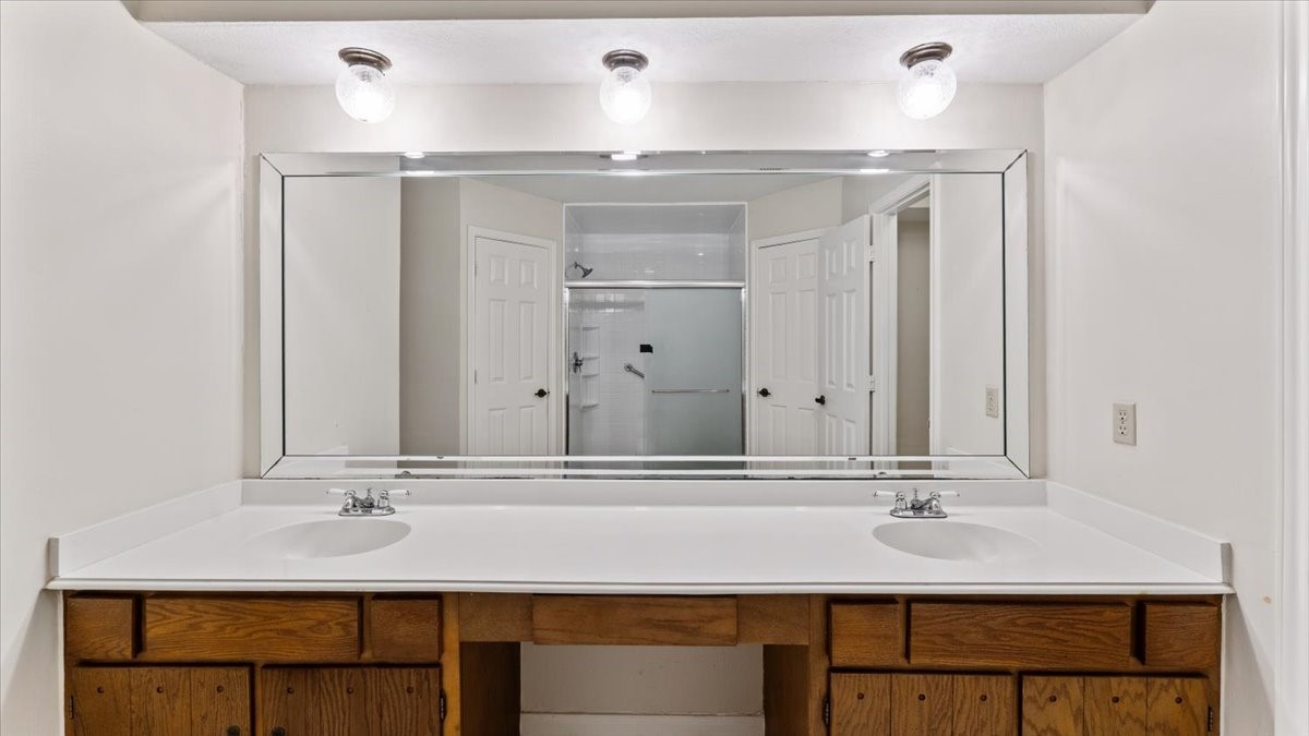 6502 Moccasin Bend Drive Spring, TX 77379 - Photo 34 of 38 a bathroom with a sink and a mirror