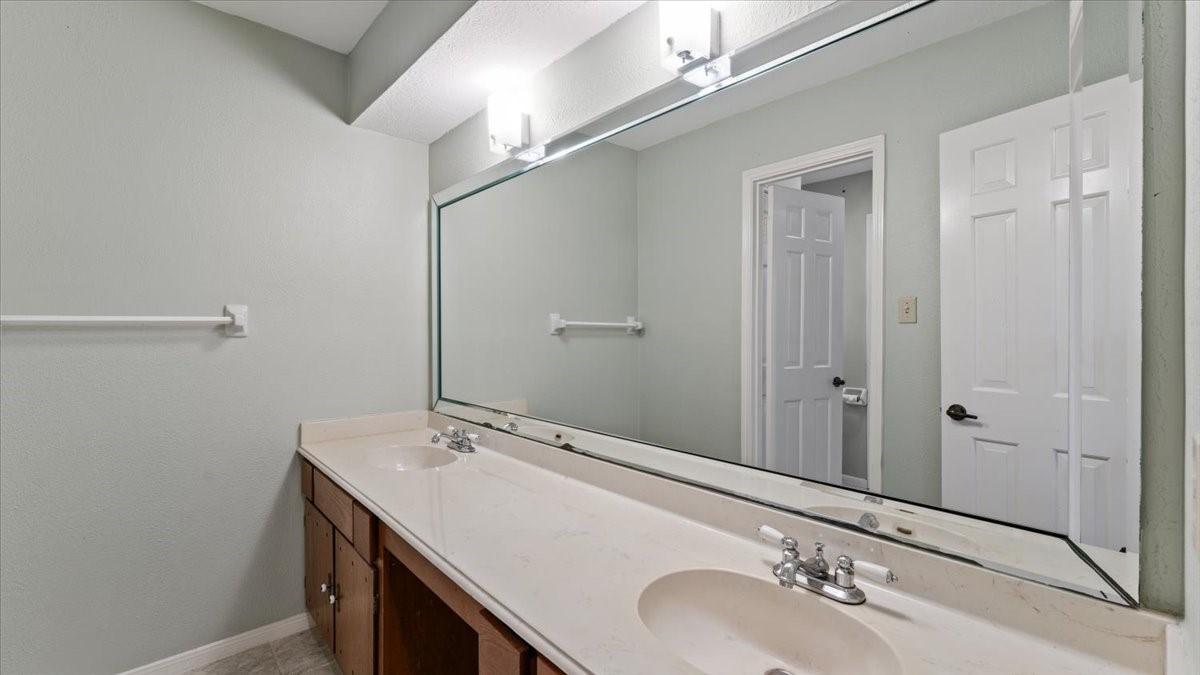 6502 Moccasin Bend Drive Spring, TX 77379 - Photo 36 of 38 a bathroom with a sink and a mirror