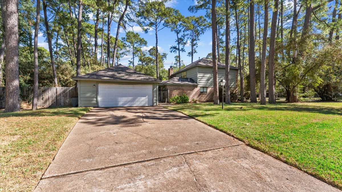 6502 Moccasin Bend Drive Spring, TX 77379 - Photo 4 of 38 a view of a yard with plants and trees