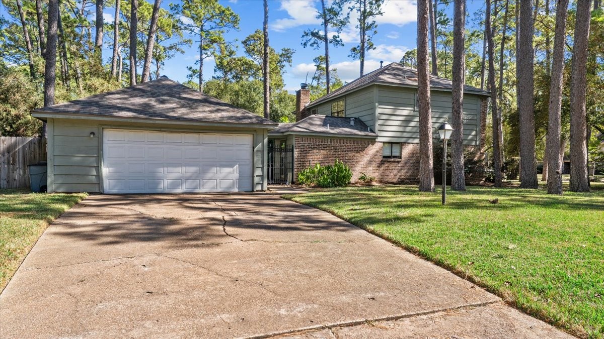 6502 Moccasin Bend Drive Spring, TX 77379 - Photo 7 of 38 a front view of a house with a yard and garage