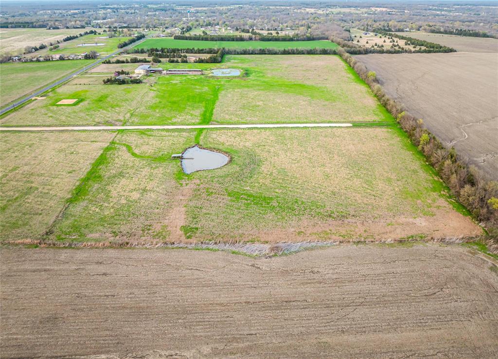 Lot 14 Farm Road Blossom, TX 75416 - Photo 5 of 6 a view of a swimming pool
