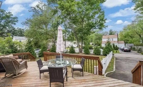 a view of balcony with furniture and trees