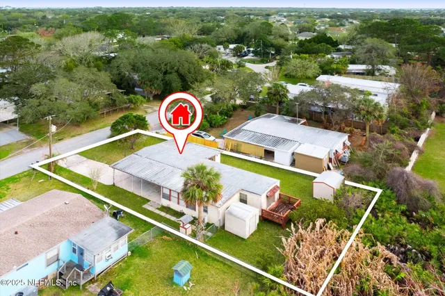 an aerial view of residential house with outdoor space