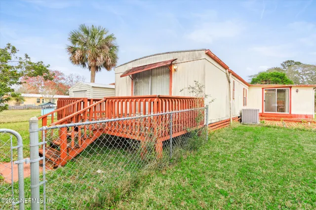 a balcony with wooden floor and city view