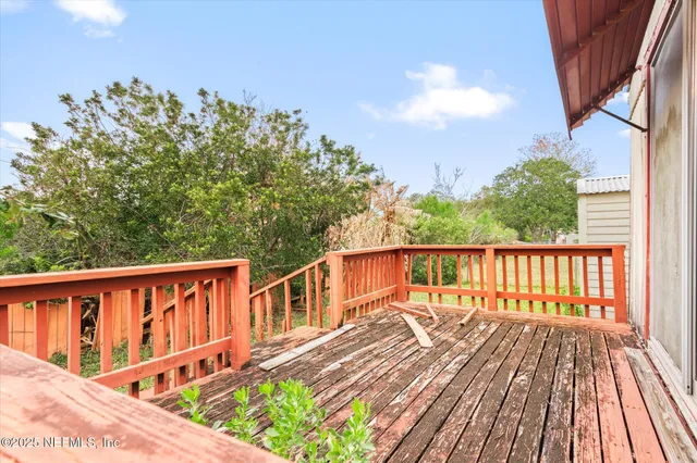 a front view of house with a garden and patio