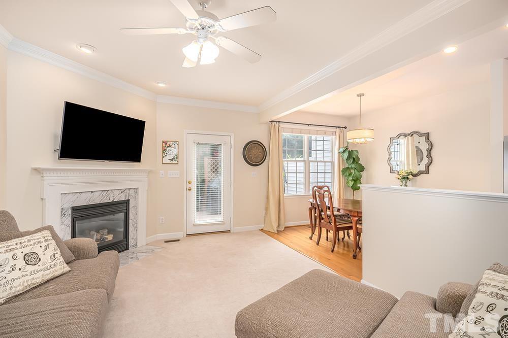 4559 Treerose Way Raleigh, NC 27606 - Photo 3 of 15 Living room with fireplace