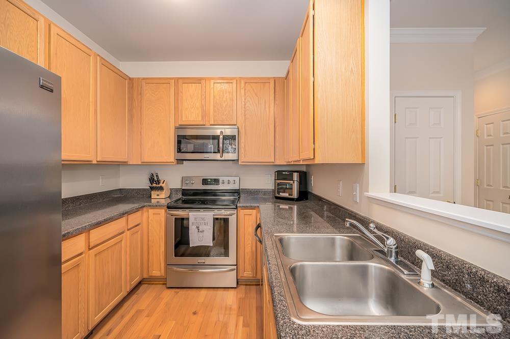 4559 Treerose Way Raleigh, NC 27606 - Photo 5 of 15 Kitchen with plenty of cabinet space