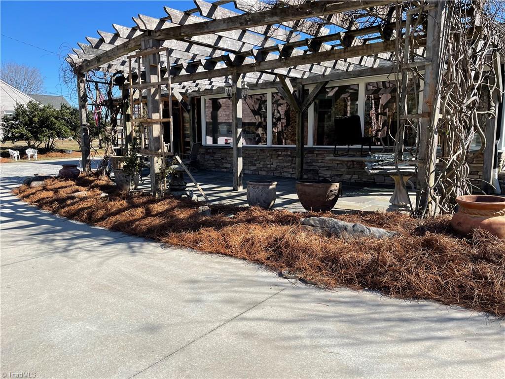 2532 Darrow Road Walkertown, NC 27051 - Photo 33 of 38 Open patio area with pergola -