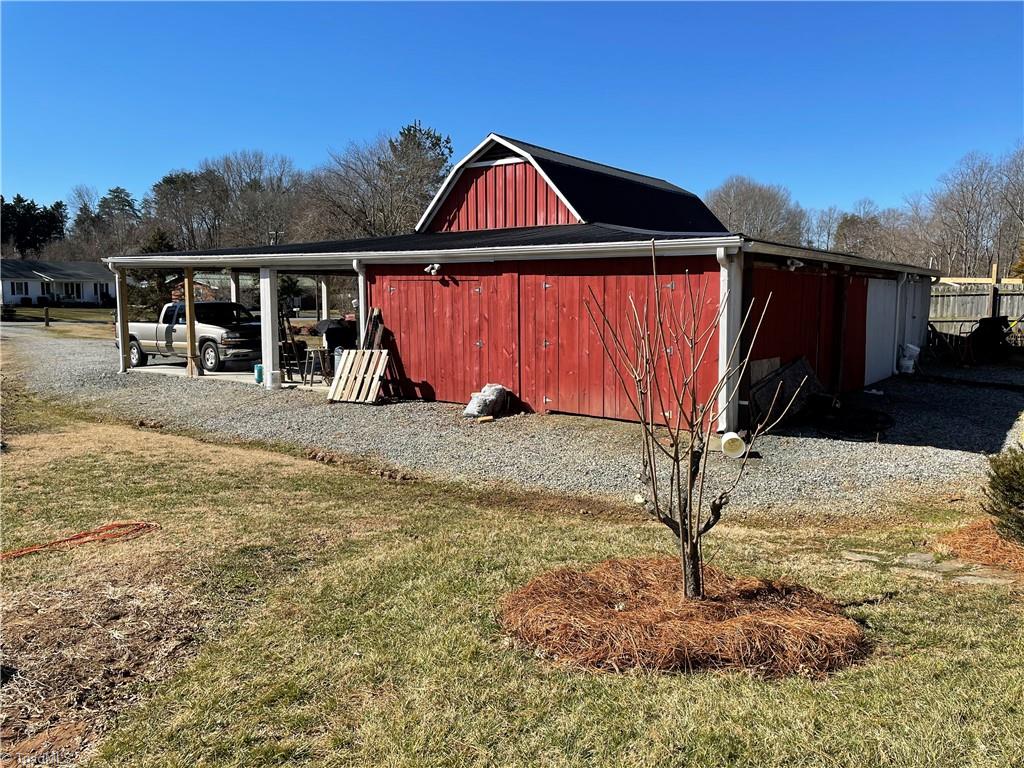 2532 Darrow Road Walkertown, NC 27051 - Photo 37 of 38 Barn is multi-functional ( 55 x 55 under roof space) and includes office /workshop/storage area @ 25" x 12" with HVAC; 8' x 10" walk-in cooler; open concrete floored covered space for vehicles, other enclosed sections for farm & lawn tools & equipment.