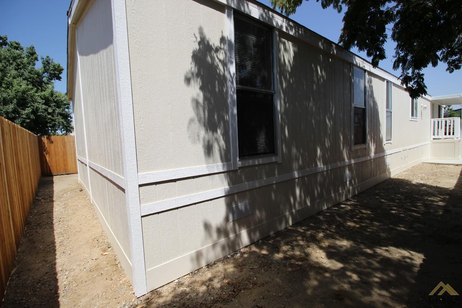 Undisclosed Address Bakersfield, CA 93308 - Photo 6 of 26 a view of a house with a street