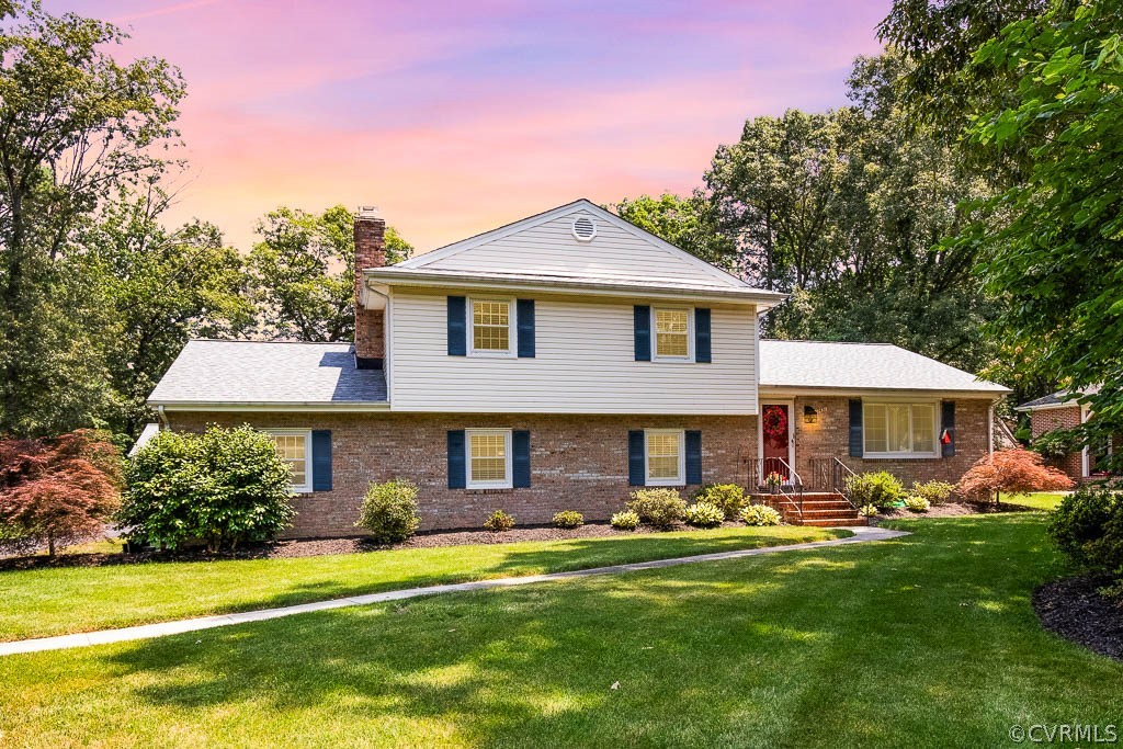 11431 Driscoll Road Chester, VA 23831 - Photo 1 of 41 a front view of a house with a yard