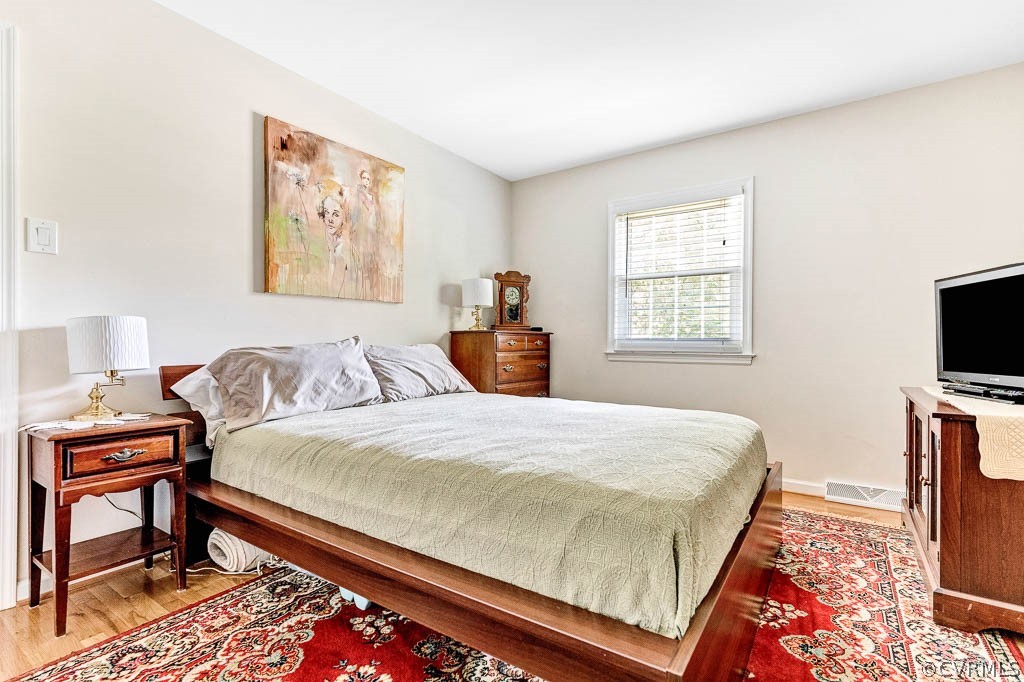 11431 Driscoll Road Chester, VA 23831 - Photo 26 of 41 a bedroom with a bed and a tv on table