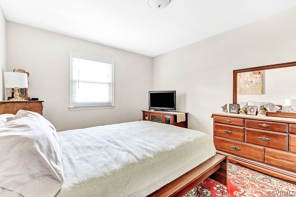 11431 Driscoll Road Chester, VA 23831 - Photo 27 of 41 a bedroom with a bed and a flat screen tv