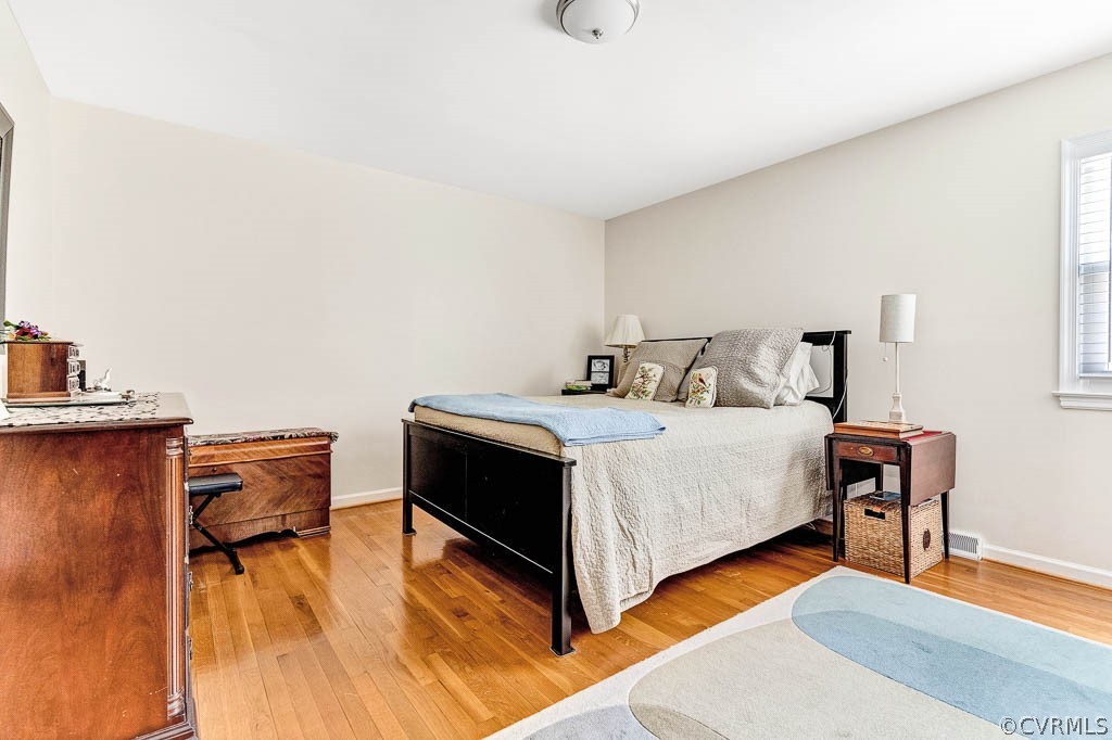 11431 Driscoll Road Chester, VA 23831 - Photo 28 of 41 a bedroom with a bed and a chair