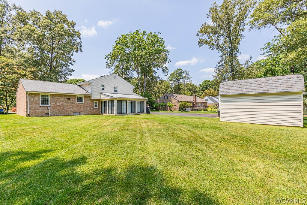 11431 Driscoll Road Chester, VA 23831 - Photo 33 of 41 a front view of a house with a garden