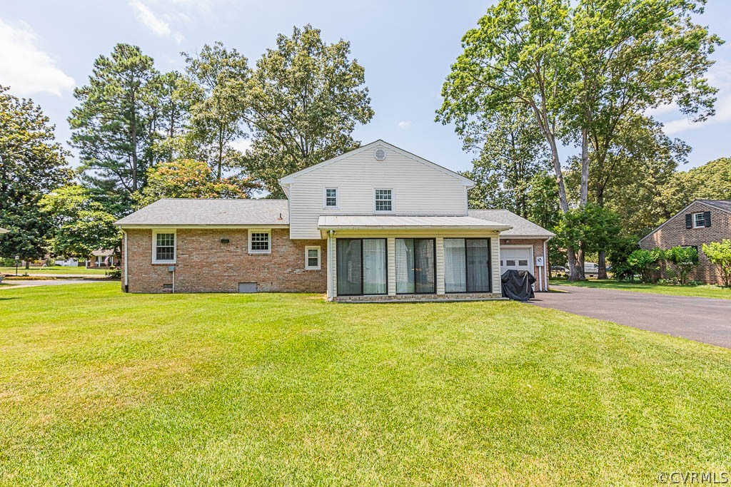 11431 Driscoll Road Chester, VA 23831 - Photo 34 of 41 a front view of a house with a garden