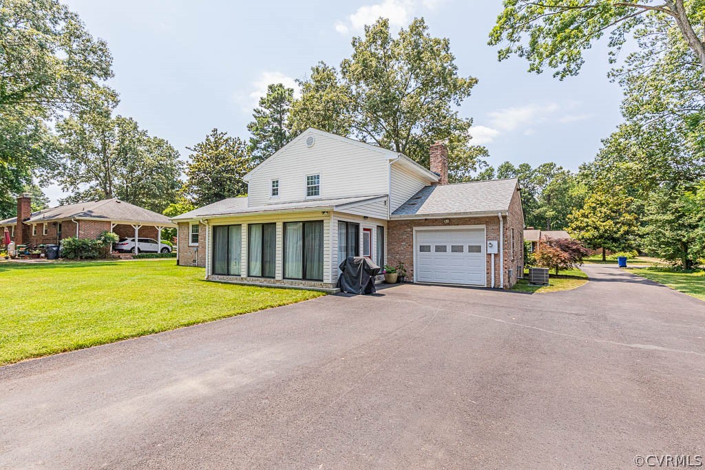 11431 Driscoll Road Chester, VA 23831 - Photo 35 of 41 a view of house with outdoor space and swimming pool