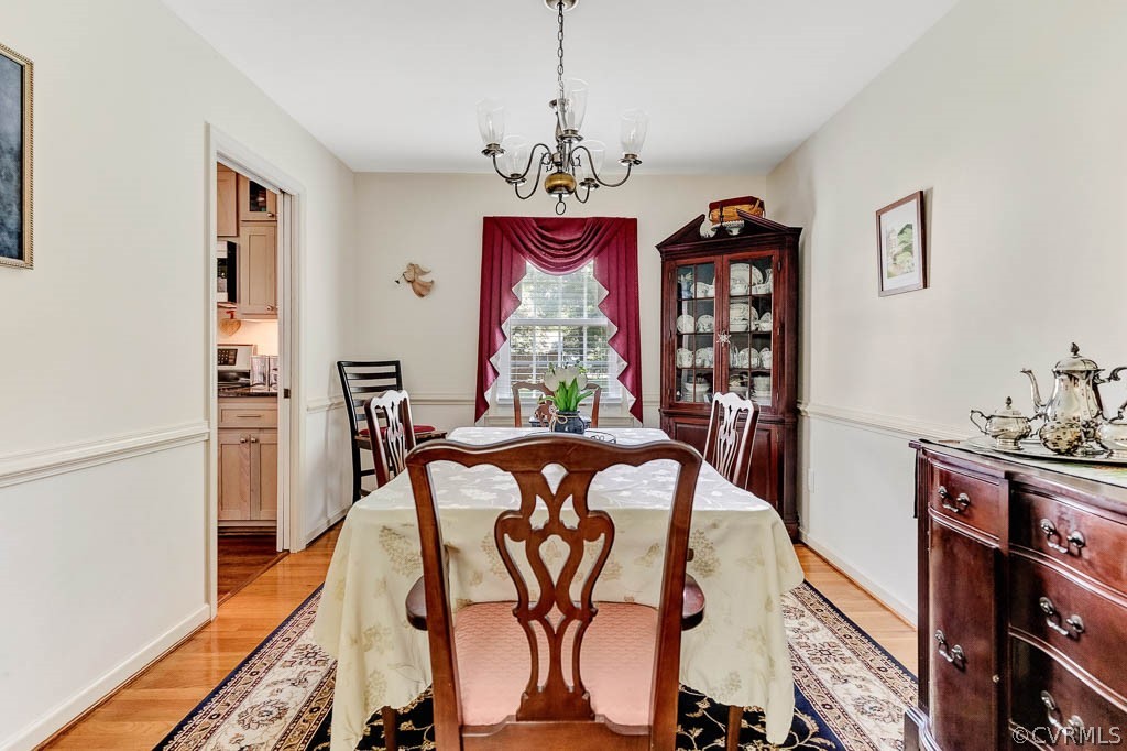 11431 Driscoll Road Chester, VA 23831 - Photo 7 of 41 a view of a dining room with furniture window and wooden floor