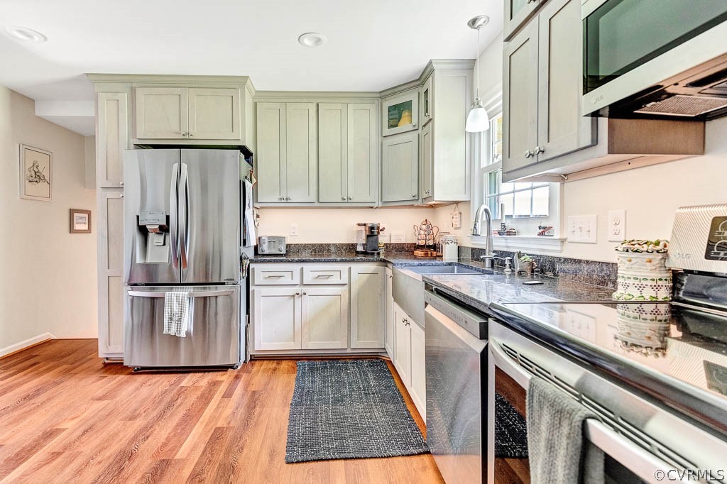 11431 Driscoll Road Chester, VA 23831 - Photo 9 of 41 a kitchen with granite countertop stainless steel appliances a refrigerator and a sink