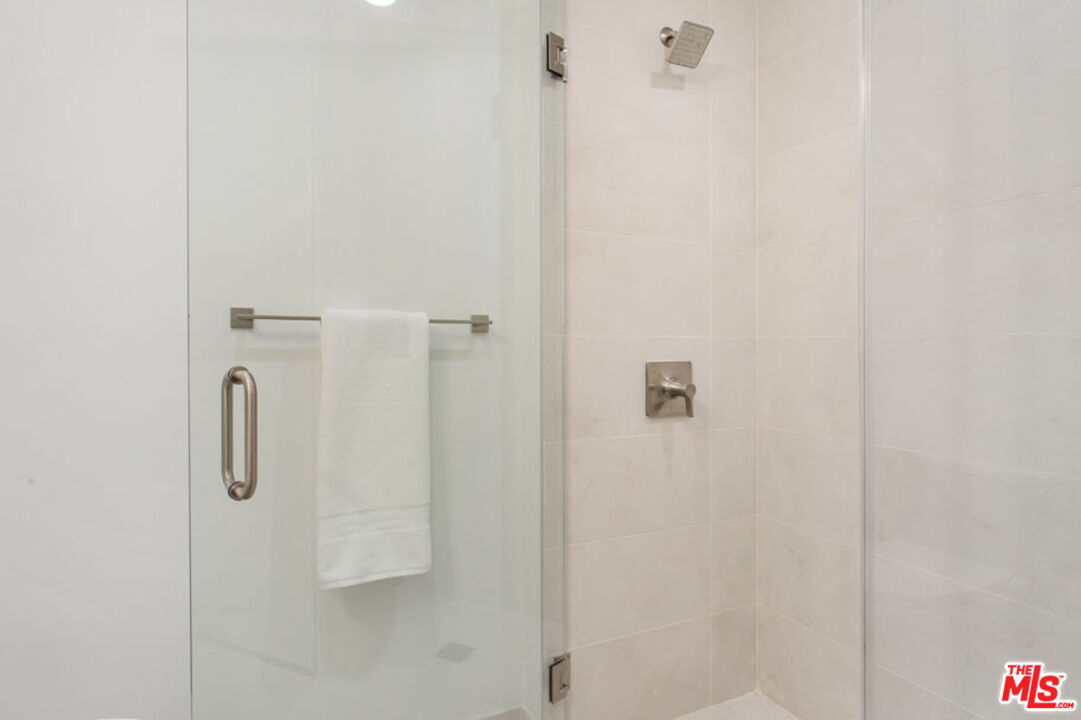 10310 Santa Monica Boulevard, Unit 216 Los Angeles, CA 90025 - Photo 12 of 38 a bathroom with a shower