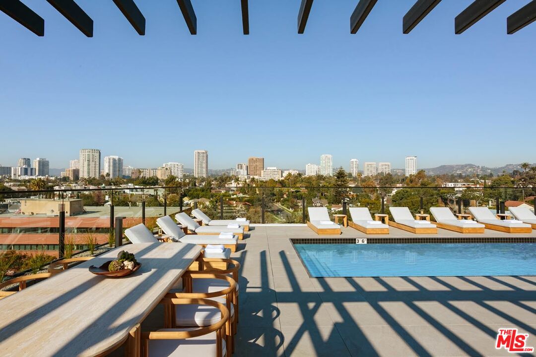 10310 Santa Monica Boulevard, Unit 216 Los Angeles, CA 90025 - Photo 26 of 38 a view of a balcony with chairs