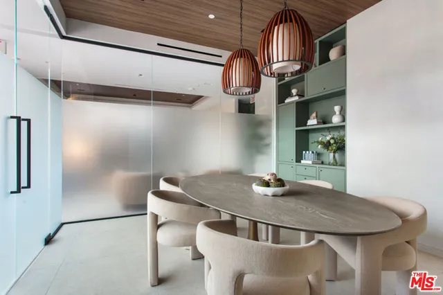 a dining room with furniture and window