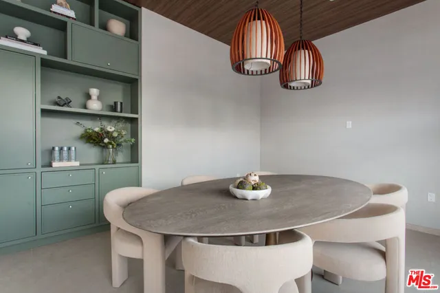 a kitchen with a table and chairs in it