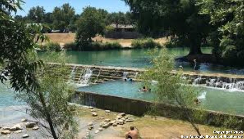 Lot 85 Headwaters Ranch Road Kendalia, TX 78027 - Photo 19 of 36 an aerial view of a house with a yard and lake view