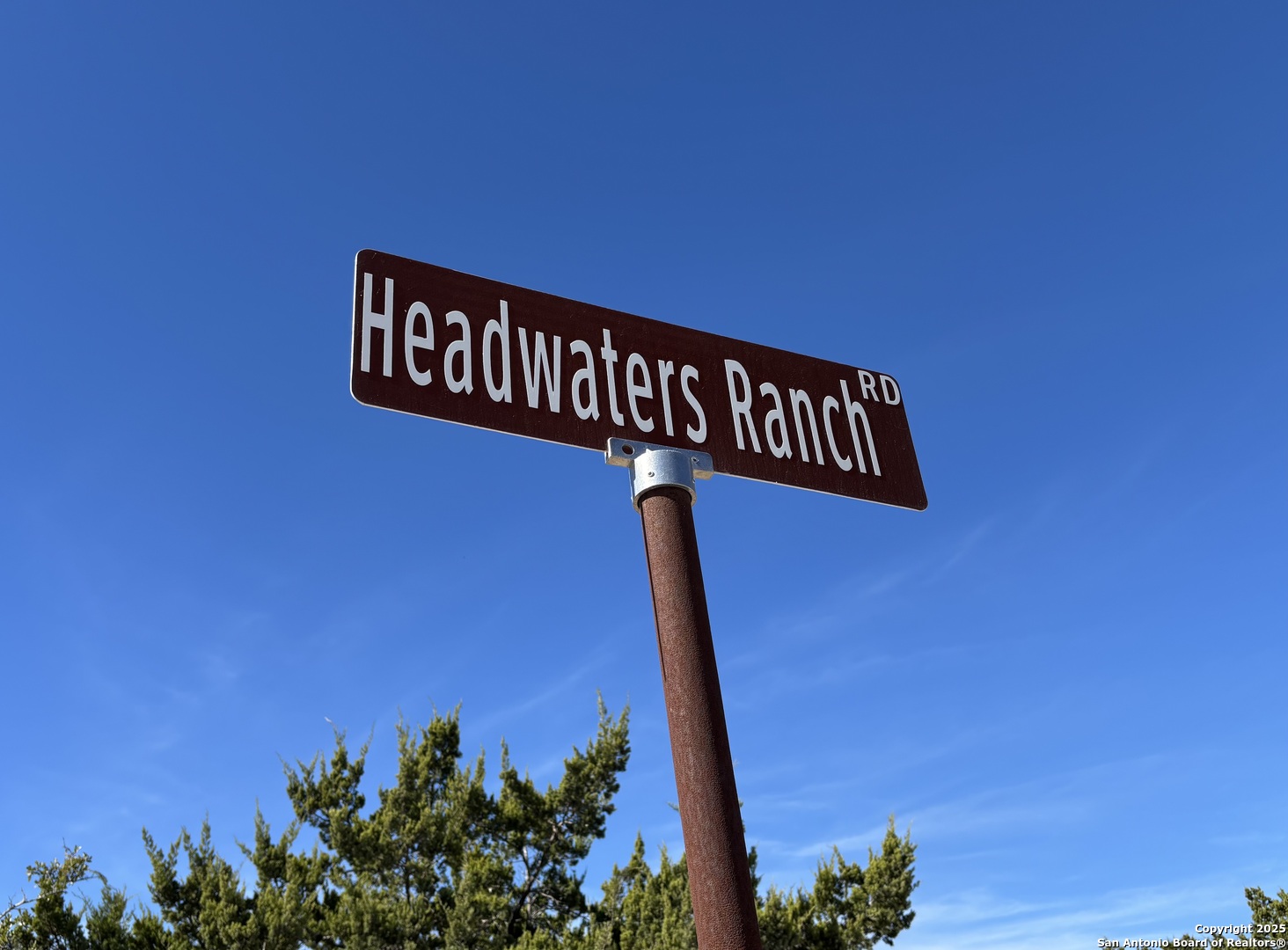 Lot 85 Headwaters Ranch Road Kendalia, TX 78027 - Photo 2 of 36 a close up of a street sign