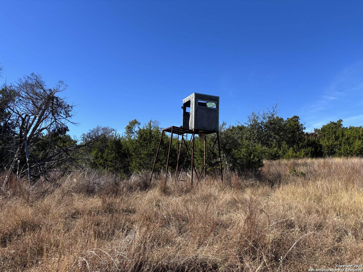 Lot 85 Headwaters Ranch Road Kendalia, TX 78027 - Photo 31 of 36 a view of a wooden floor and a lake in the background