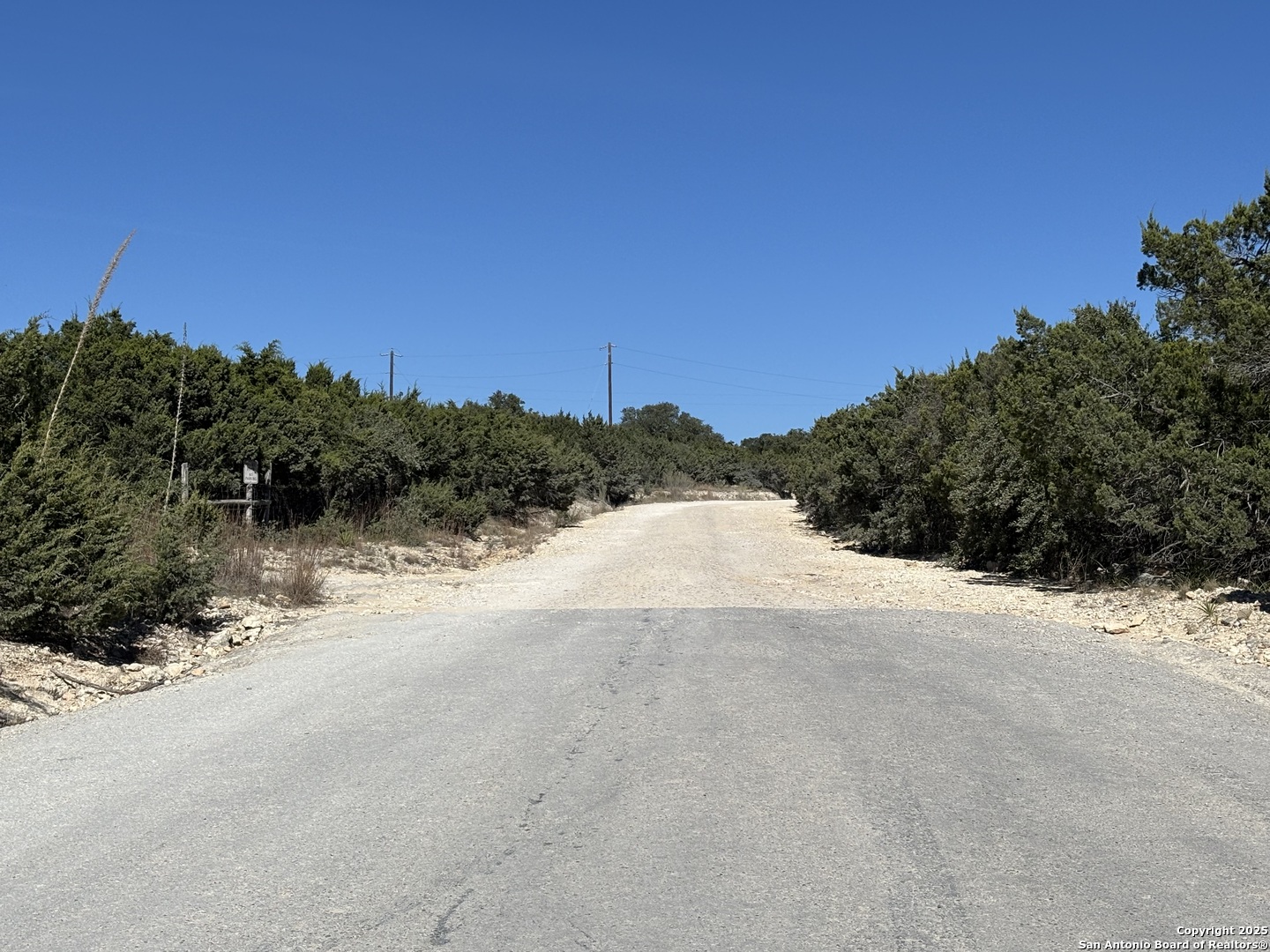 Lot 85 Headwaters Ranch Road Kendalia, TX 78027 - Photo 35 of 36 a view of a road with a building in the background