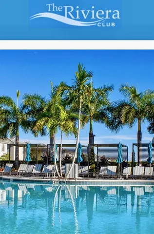 a view of a swimming pool with outdoor seating